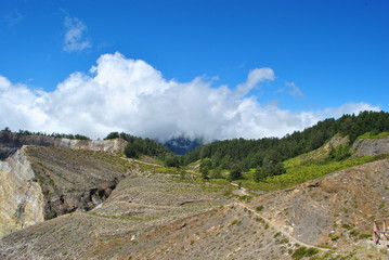 the hills around Kelimutu volcano colored crater lakes, Flores, Indonesia