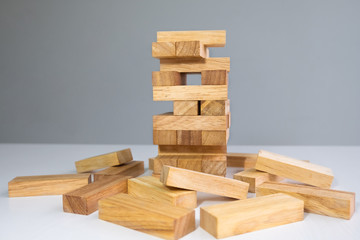 Wood block tower with architecture model, Concept Risk of management and strategy plan, growth business success process and team work