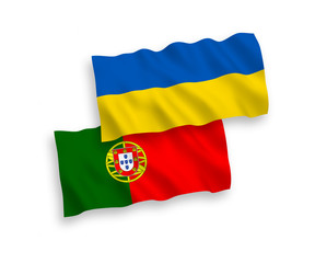 National vector fabric wave flags of Portugal and Ukraine isolated on white background. 1 to 2 proportion.