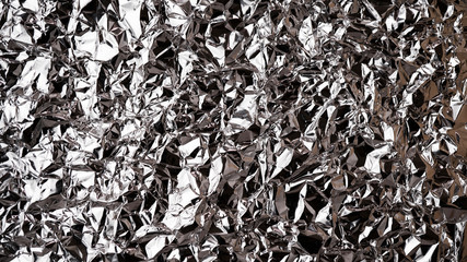 Texture of crumpled aluminum foil. Background image. Metallic shine