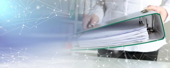 Businesswoman holding a binder; multiple exposure