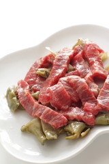 Chinese cooking, beef and szechuen pickles prepared on dish