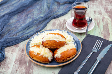 Traditional Turkish pastry pogaca with cheese filling. Turkish name: Sakalli, sacakli, corek -...