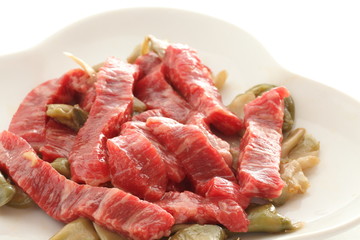 Chinese cooking, beef and szechuen pickles prepared on dish