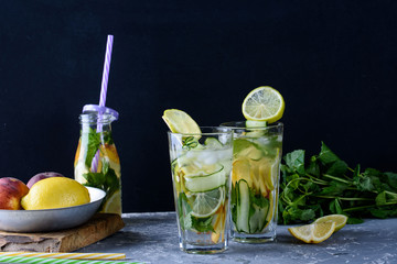 A cool drink with fresh fruit and ice. Peppermint, peach, lemon, lime.