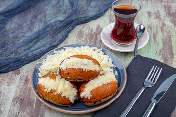 Traditional Turkish pastry pogaca with cheese filling. Turkish name: Sakalli, sacakli, corek -...