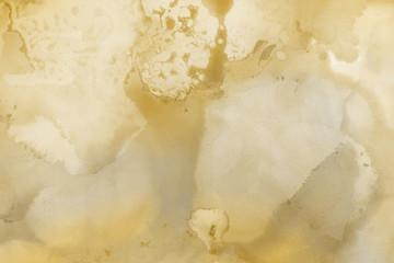 Hand painted gold alcohol ink background. Abstract delicate yellow texture. Contemporary wallpaper. 