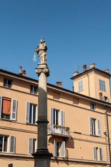 Fototapeta na wymiar Tower of the church Italy Tuscany saint sculpture