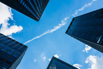 Fototapeta na wymiar cross of skyscrapers and blue sky