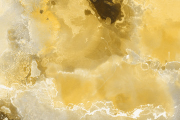 Hand painted gold alcohol ink background. Abstract delicate yellow texture. Contemporary wallpaper. 