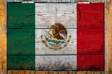 National flag of Mexico on a wooden wall background.The concept of national pride and symbol of the...