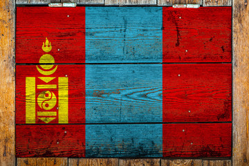 National flag of Mongolia on a wooden wall background.The concept of national pride and symbol of...