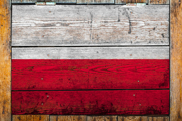 National flag of Poland on a wooden wall background.The concept of national pride and symbol of the...