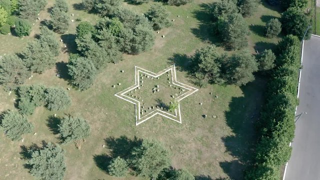 Huge stone Star of David on an old jewish cemetery in Belarus. Aerial of jew symbol.
