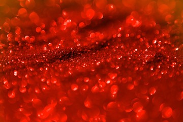 red brilliant metall sand made of glitters - festival concept with bokeh texture - pretty abstract photo background