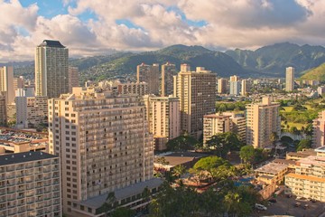 Fototapeta na wymiar City view. View to Hotels, apartments and mountain range in Honolulu.