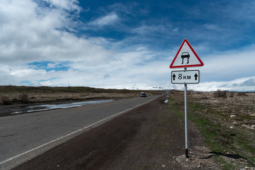 slippy road sign, asphalt highway