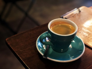 Black coffee Wake me up, Black coffee in white and green cup on the wooden table, hot america-no , love coffee