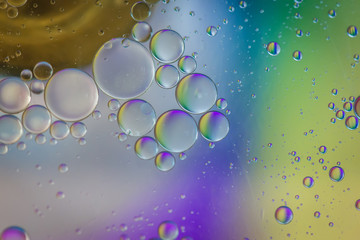 Oil drops in water. Abstract psychedelic pattern image multicolored. Abstract background with colorful gradient colors. DOF.