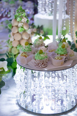 candy bar, various cakes on decorative coasters