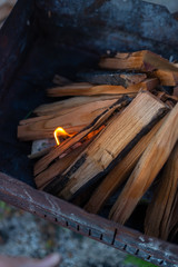firewood is burning in a barbecue