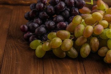 Fresh ripe grape on wooden table