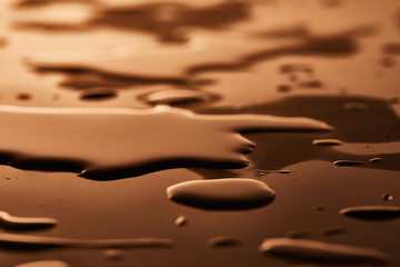 water puddles and drops on brown background