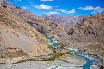Himalayan mountain landscape along Leh to Manali highway. Blue river and rocky mountains in Indian...