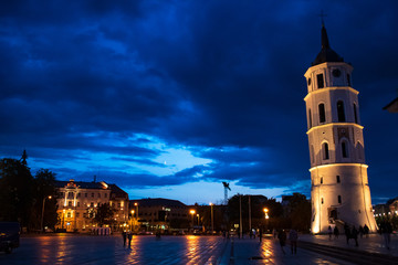Fototapeta na wymiar Vilnius, Lithuania. The View Of Cathedral Square With Bell Tower And Cathedral Basilica Of St. Stanislaus And St. Vladislav in summer at night with blue sky after the rain