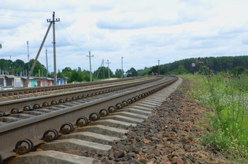 Railway stones at railroad track. Landscape with sky. Outskirts of Vitebsk, Belarus