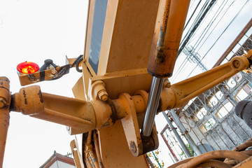 road-building machinery, tractors yellow excavators in the open air in working position