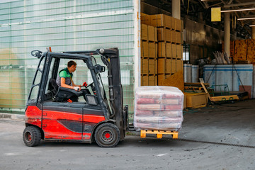 Forklift loader pallet stacker truck at small warehouse © Mulderphoto