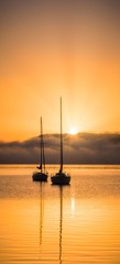 Sunrise over sailboats 