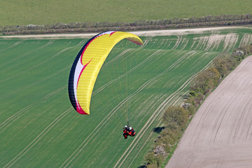 Tandem Paraglider flying at Combe Gibbet, England