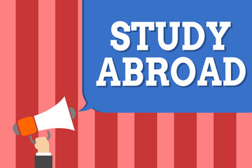 Fototapeta premium Handwriting text writing Study Abroad. Concept meaning Pursuing educational opportunities in a foreign country Man holding megaphone loudspeaker speech bubble message speaking loud
