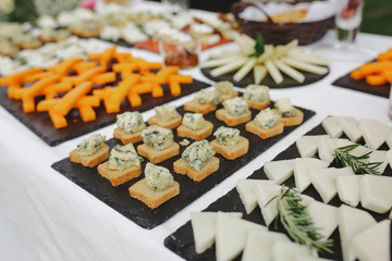 catering table with different cheeses