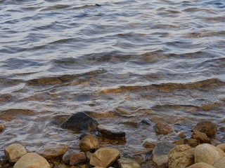 Close up of water rippling on the stony banks of Lake Elmer Thomas, Oklahoma