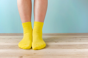 Standing in the room with socks. 靴下で部屋に立っている人