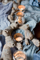 table setting with candles and blue tissue