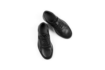 black children’s leather shoes with a white background, isolate
