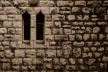 Fototapeta na wymiar Sandstone wall with two windows, Small Windows , Two windows in a sandstone wall, Sandstone wall, Black and White
