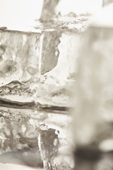 Obraz na płótnie Canvas close up view of pure transparent wet textured ice cubes