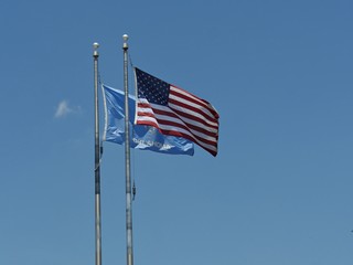 Wide shot of the flags of the United States of America and Oklahoma State