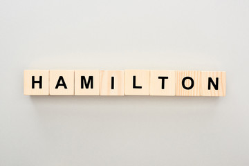 top view of wooden blocks with Hamilton lettering on grey background