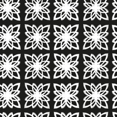Simple floral monochrome seamless pattern. Decorative texture. White hand drawn flowers at the black background