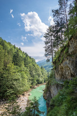 Vertical view of a scenic gorge with beautiful blue colored water in the european Alps