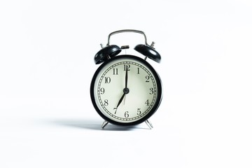 Black alarm clock isolated on white