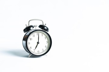 Black alarm clock isolated on white