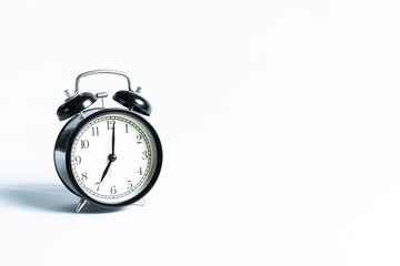 Black alarm clock isolated on white