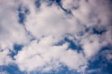 Thick white cloud on blue sky background.